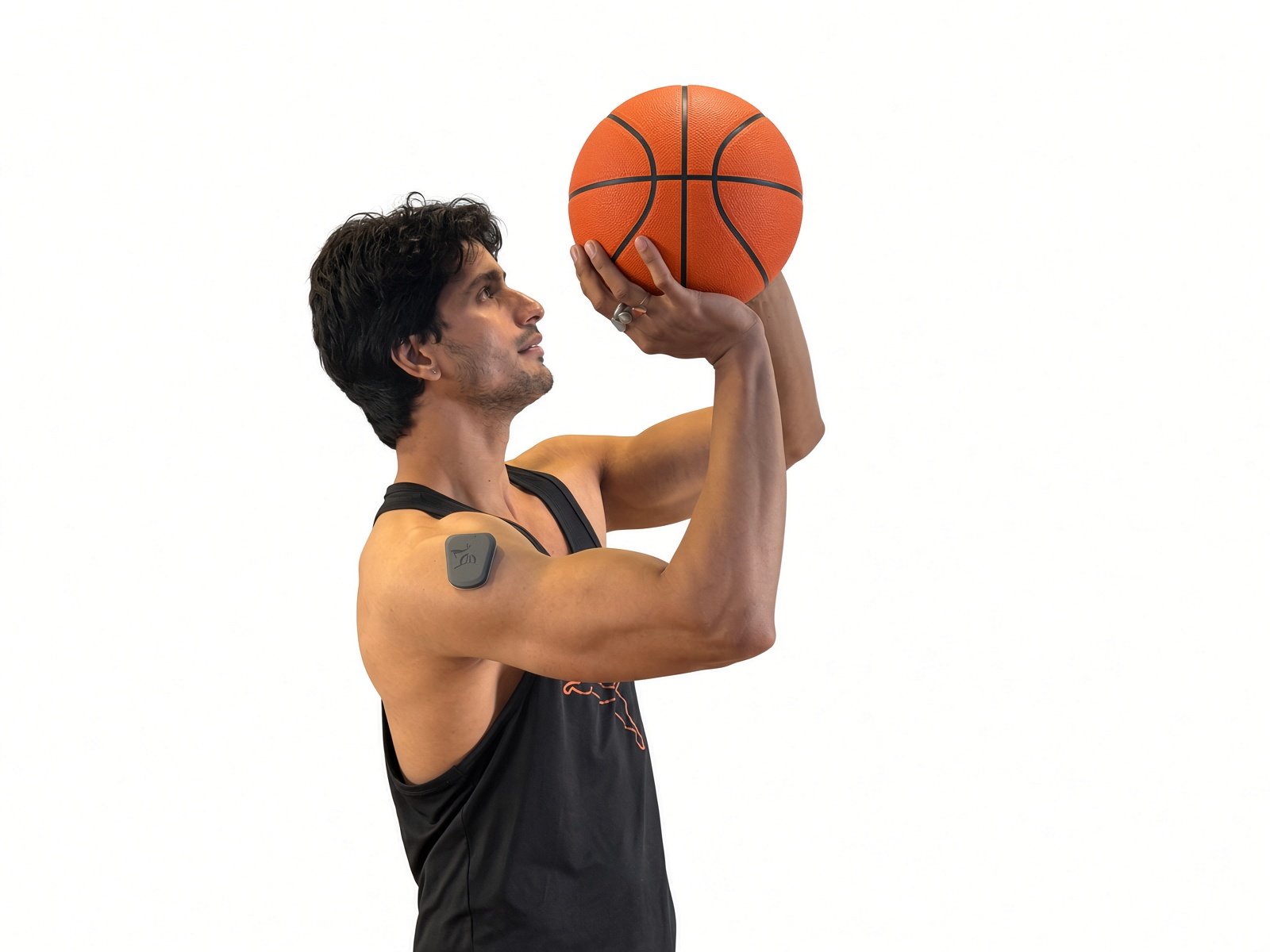 An athlete wearing the Puck on his shoulder shooting a basketball
