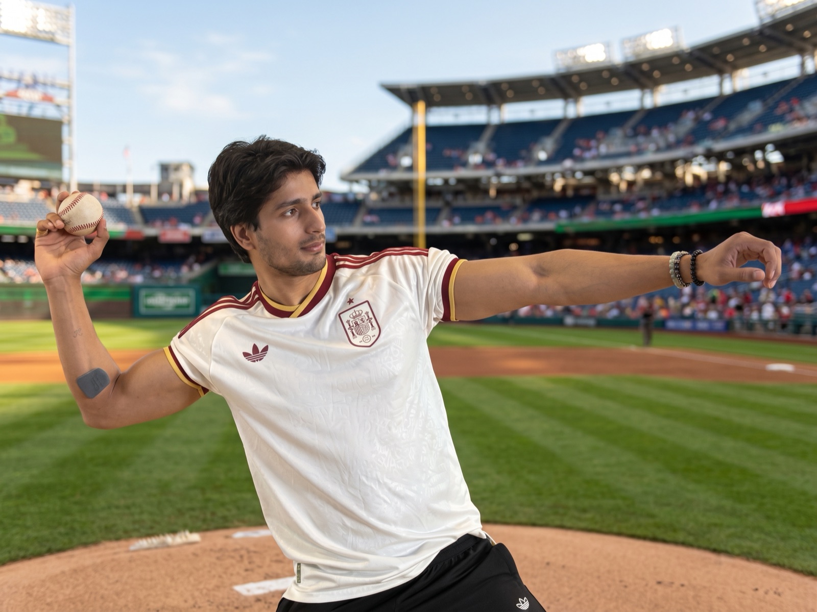 Athlete wearing the Muscle Puck on his forearm before throwing a pitch
